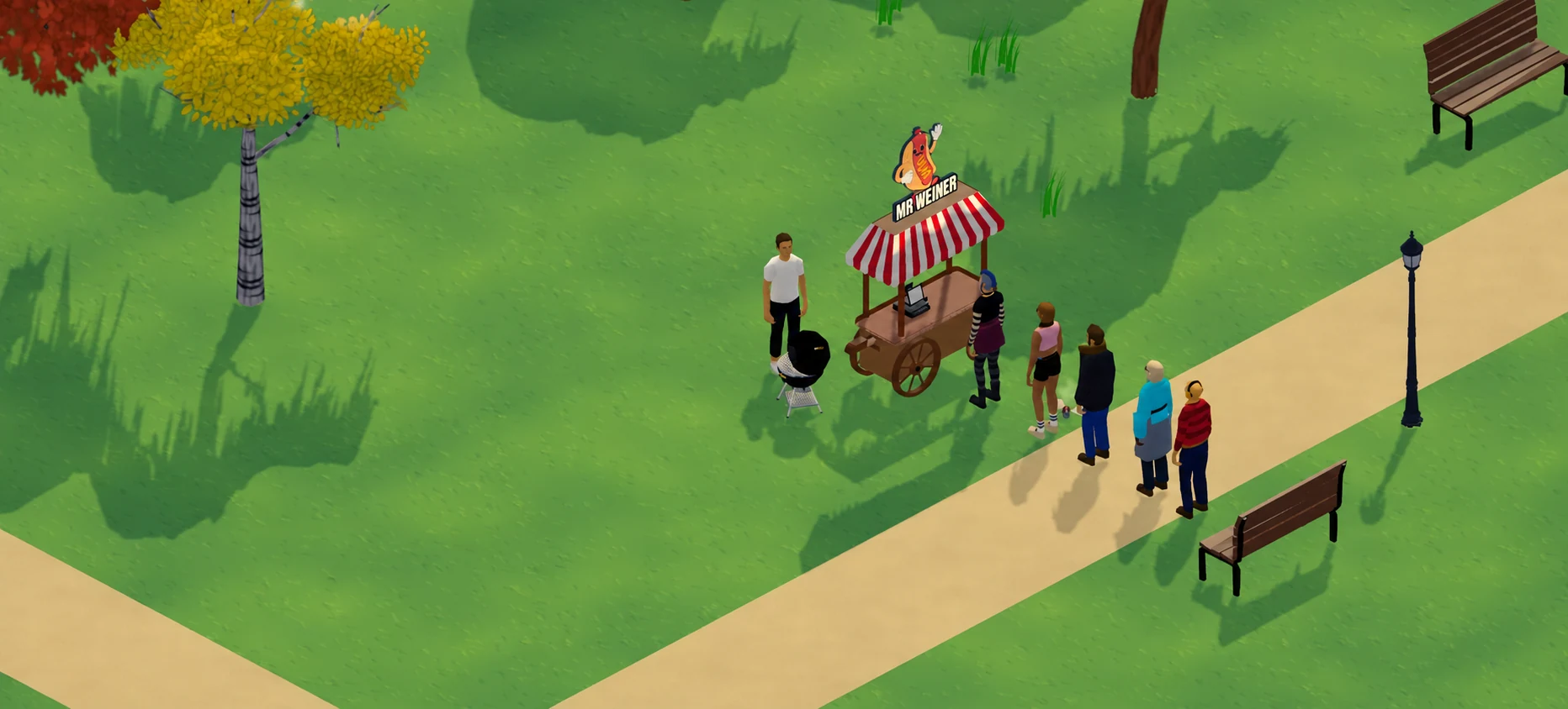 Customers queue beside the hot dog stand in a sunny park.